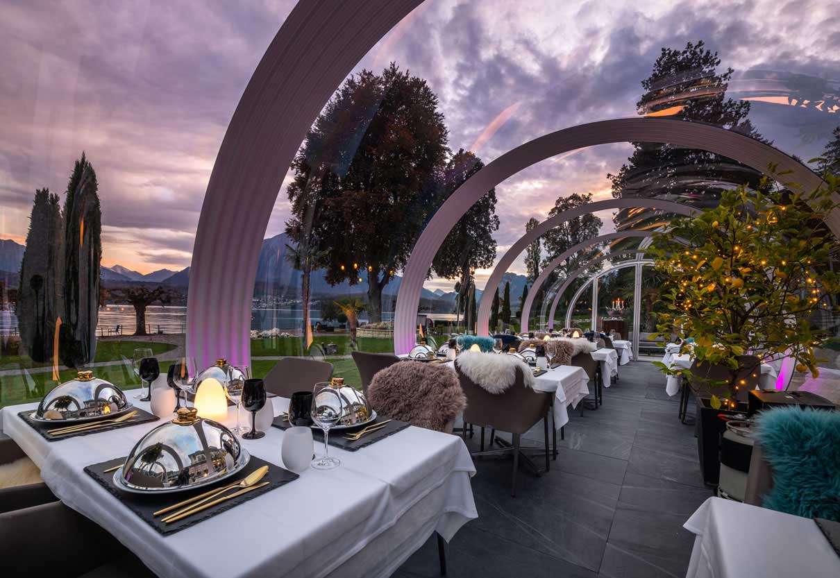 Outdoor bubble dome restaurant terrace at Parkhotel Gunten